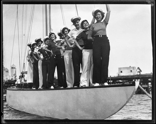 Young women on a boat at the Yacht Harbor Breakwater dedication, Santa Monica