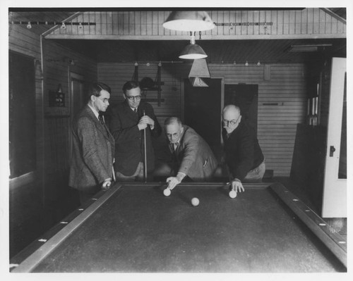Scientists playing pool in the Hooker cottage, Mount Wilson Observatory