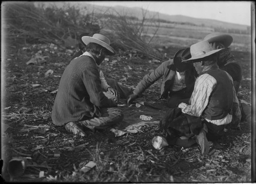 Paiute Indian men playing cards and gambling, Wadsworth, Nevada