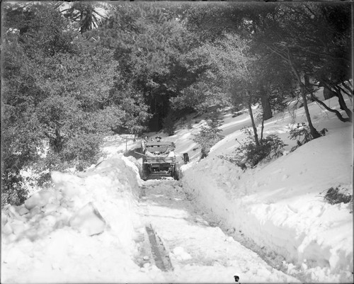 George Jones and Tom Nelson in a truck on a snowy road, near the Mount Wilson Hotel