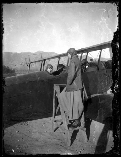 Female aviators and an airplane approximately 1915