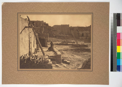 The plaza, Oraibi, showing the ladders descending to underground chambers called Kivas, where all the sacred and secret ceremonies of the Hopi take place