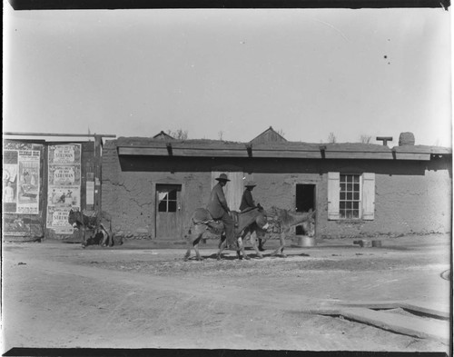 Santa Fe street scene, men on donkeys