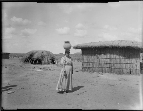 Woman carrying pot on head