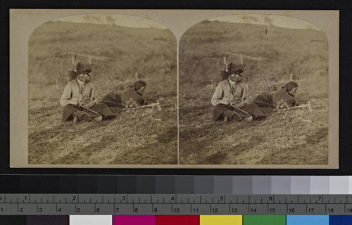 Two Winnebago Indian men in a field