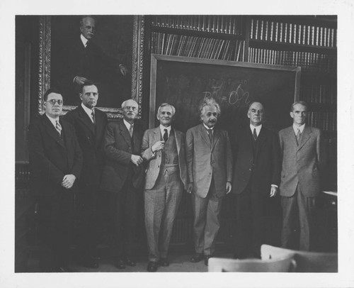 Edwin Powell Hubble, Albert Einstein and five others gathered at the Hale Library, Pasadena