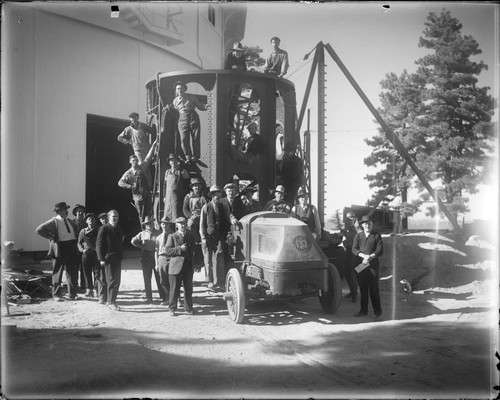 Lower section of the 100-inch telescope tube on a truck, with a crowd, at Mount Wilson Observatory