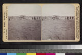 Distant view of Acoma Pueblo, New Mexico, on top of mesa. Mission Church can be seen in center