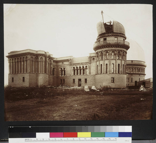 Installation of the Kenwood Observatory dome on the north dome of Yerkes Observatory, with construction workers visible