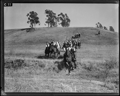 Santa Monica Lancerettes riding in a field