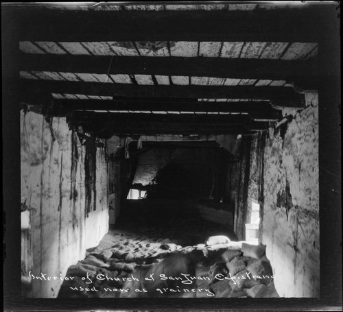 Interior of church at San Juan Capistrano, used now as grainery