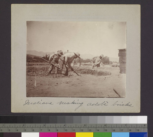 Indians making adobe bricks