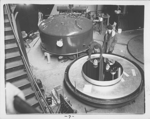 Newly aluminized 60-inch mirror in the base of the aluminizing chamber, Mount Wilson Observatory