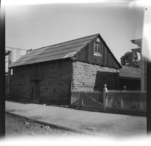 Adobe building and wooden fence, Los Angeles