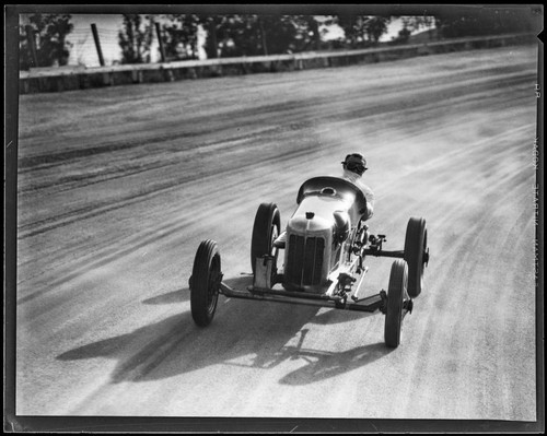 Race car driver Barney Oldfield on track at Legion Ascot Speedway, Los Angeles