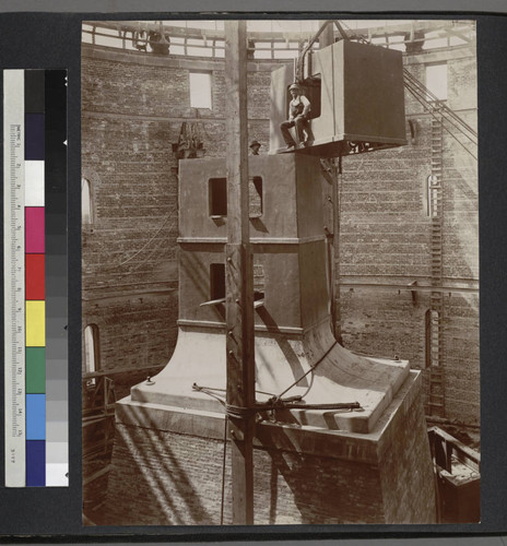 Construction of the base for the 40-inch telescope at Yerkes Observatory, with two construction workers