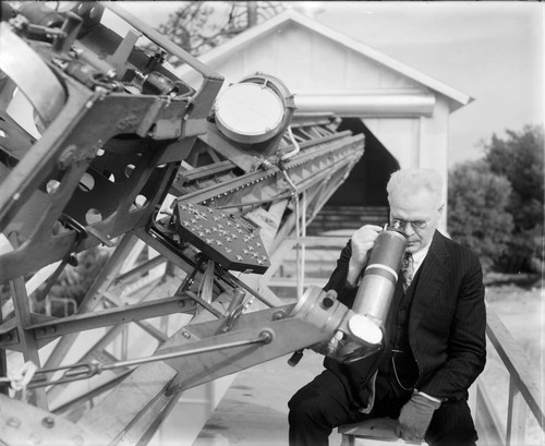 Francis Pease looking in the eyepiece of the 50-foot interferometer, Mount Wilson Observatory