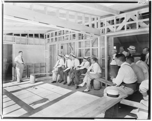 Salesmen in a house under construction, Edgeware Street, Altadena. 1938