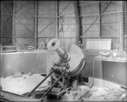 Installation of trunnion on the south float of the 100-inch telescope, Mount Wilson Observatory