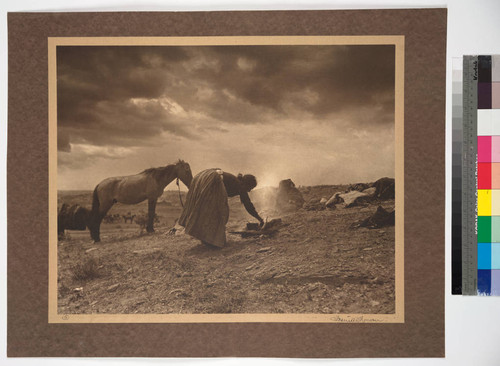 Indian Study. Navajo woman at camp fire. Black Mesa, Arizona