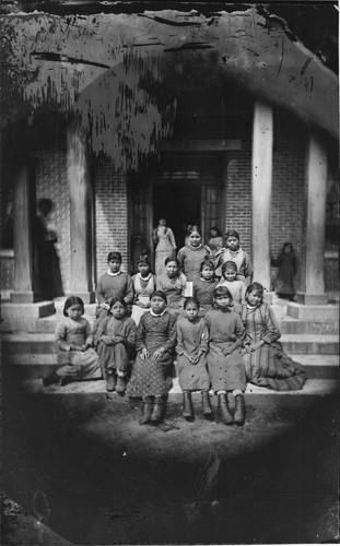 School children photographed on front steps of school