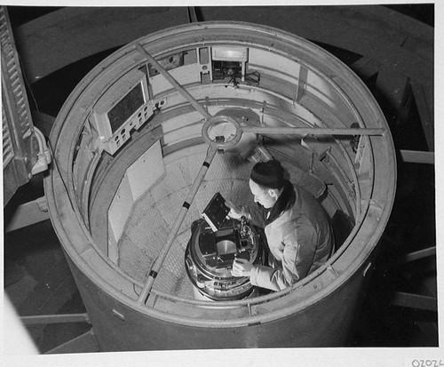 Bill Baum loading the plateholder inside the 200-inch telescope prime focus cage, Palomar Observatory