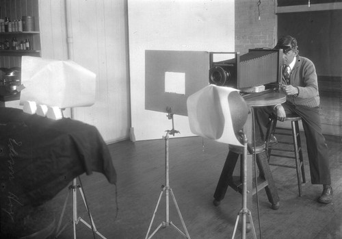 Edison Hoge taking a photograph with a view camera