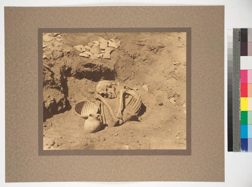 Excavating in Ancient Hopi burial ground. Showing natural burial. Arizona