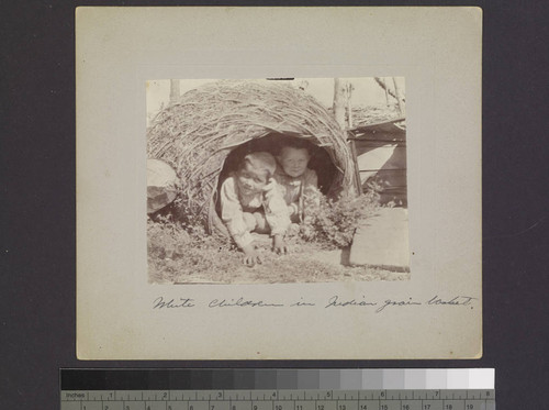 White children in Indian grain basket