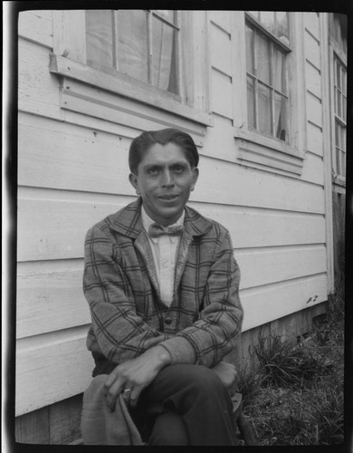 An unidentified Native American man wearing bow tie and jacket