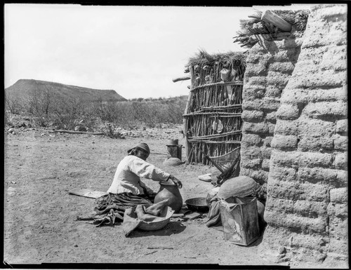 Tohono O'odham woman making pot