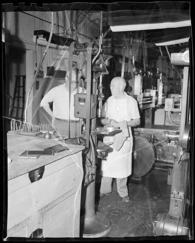 Ed Nichols and Fred Scherff inside the machine shop at Mount Wilson Observatory's workshop, Pasadena