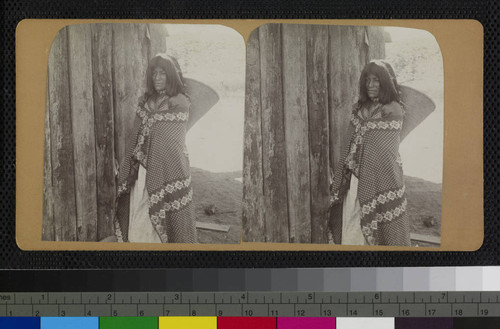 Hualapai woman carrying a basket by a strap over the top of her head