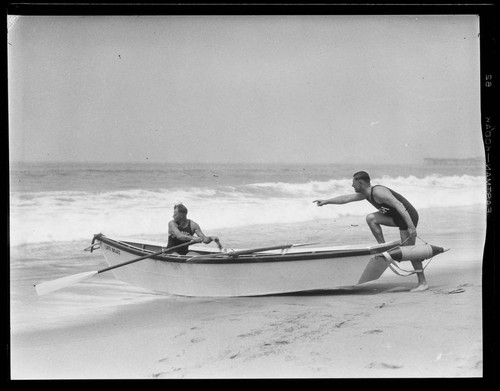 Coach and instructor taking a lifeboat out on the water for lifeguard training, Santa Monica