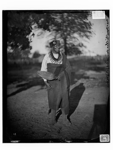 Big Walker (Sac & Fox), a tribal councillor, wearing native dress and bear claw necklace, Oklahoma Territory