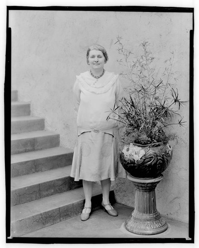 Grace Nicholson in a portrait taken in courtyard of Treasure House