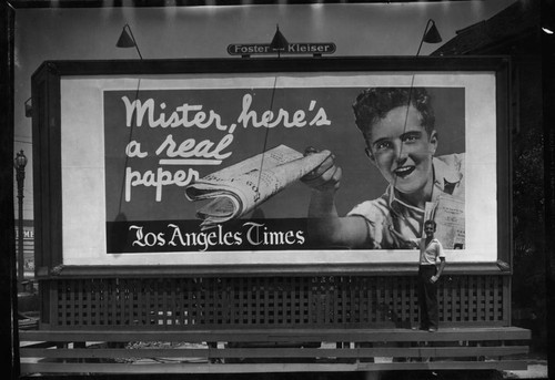 Ed Whittington and a billboard for the Los Angeles Times. 1935