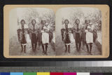 Three Pueblo Indian women, one holding a baby