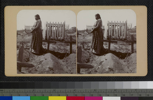 Ramona Lubo at the grave of her husband, Juan Diego, Cahuilla