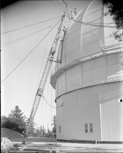 Painters on the domed roof of the 100-inch telescope dome, Mount Wilson Observatory