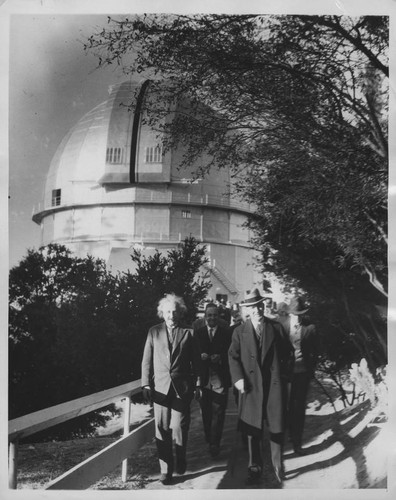 Albert Einstein, Walther Mayer and William W. Campbell walking on the footbridge away from the 100-inch telescope dome, Mount Wilson Observatory