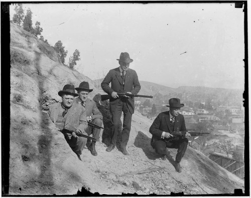 Los Angeles law enforcement officers holding rifles