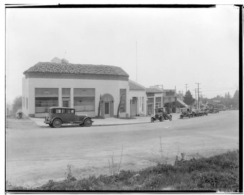 Row of businesses on Foothill Boulevard (now Altadena Drive) on the southeast corner of Foothill and Lake, Altadena. 1927