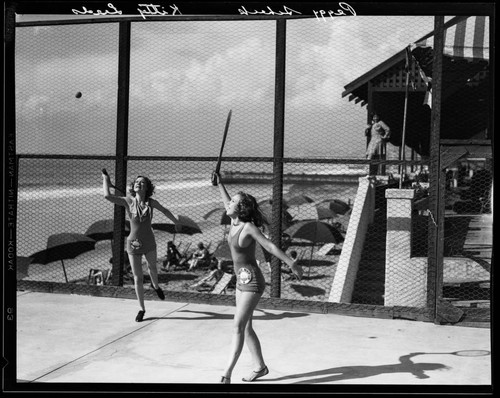 Peggy Scheck and Kitty Leeds playing tennis at the Sea Breeze Beach Club, Santa Monica