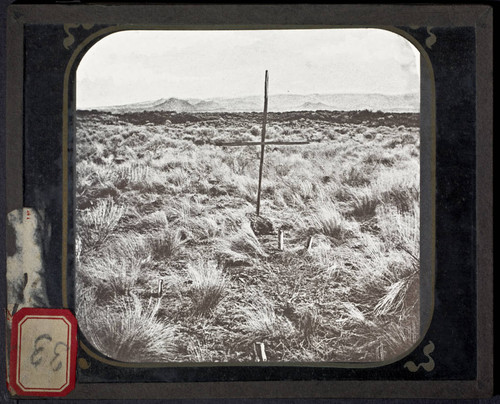 Cross in field, possibly at a grave site