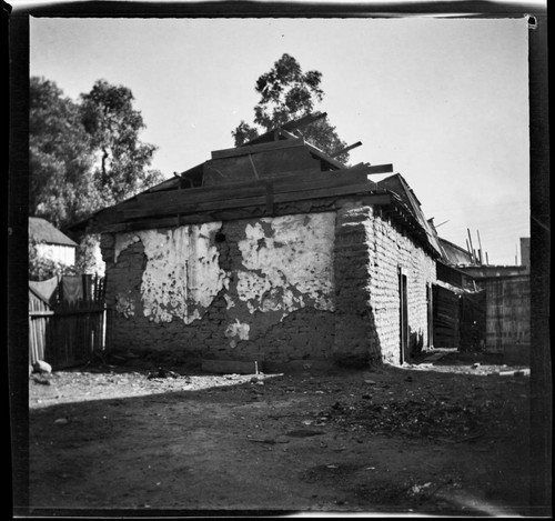 Adobe building with boarded roof