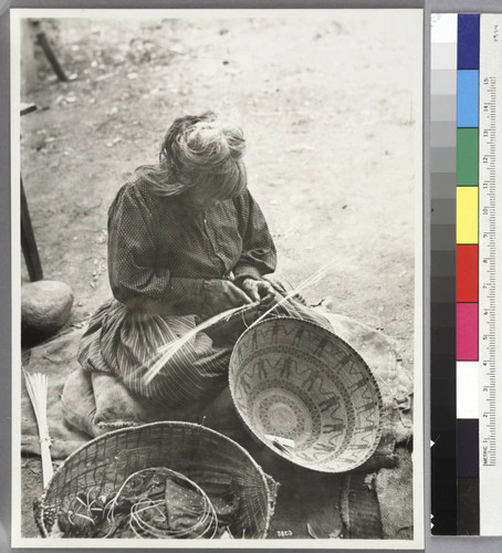 Yokut Indian woman weaving a basket