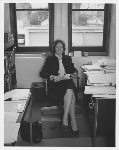 Marie-Helene Ulrich, seated at her desk