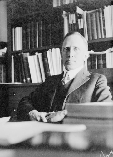 Alfred Harrison Joy, seated at his desk