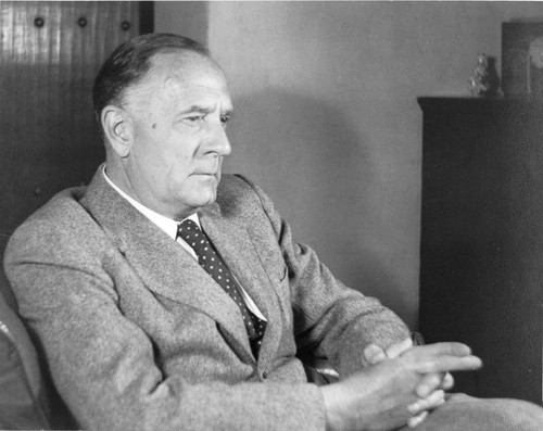 Portrait of Edwin Powell Hubble, seated